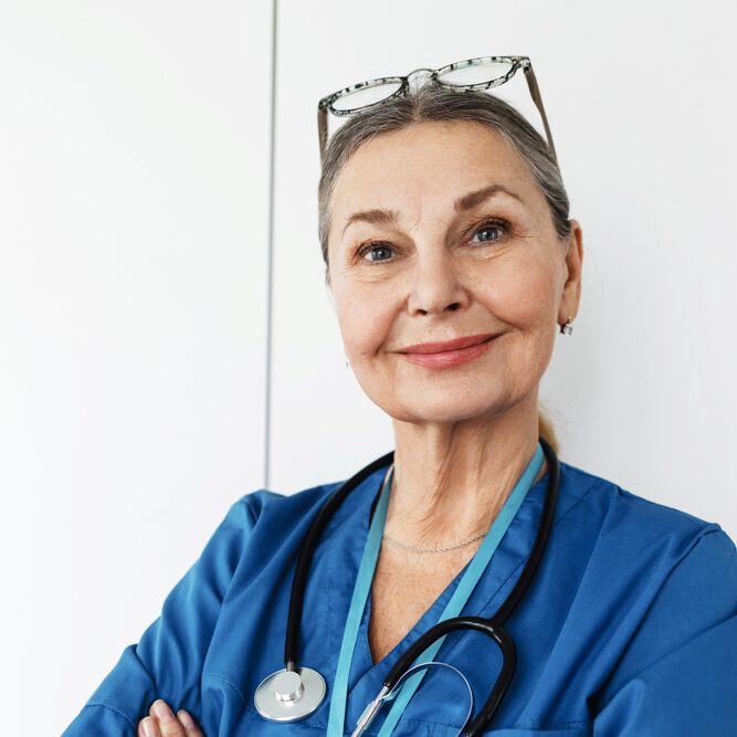 Portrait of a smiling provider wearing scrubs and a stethoscope